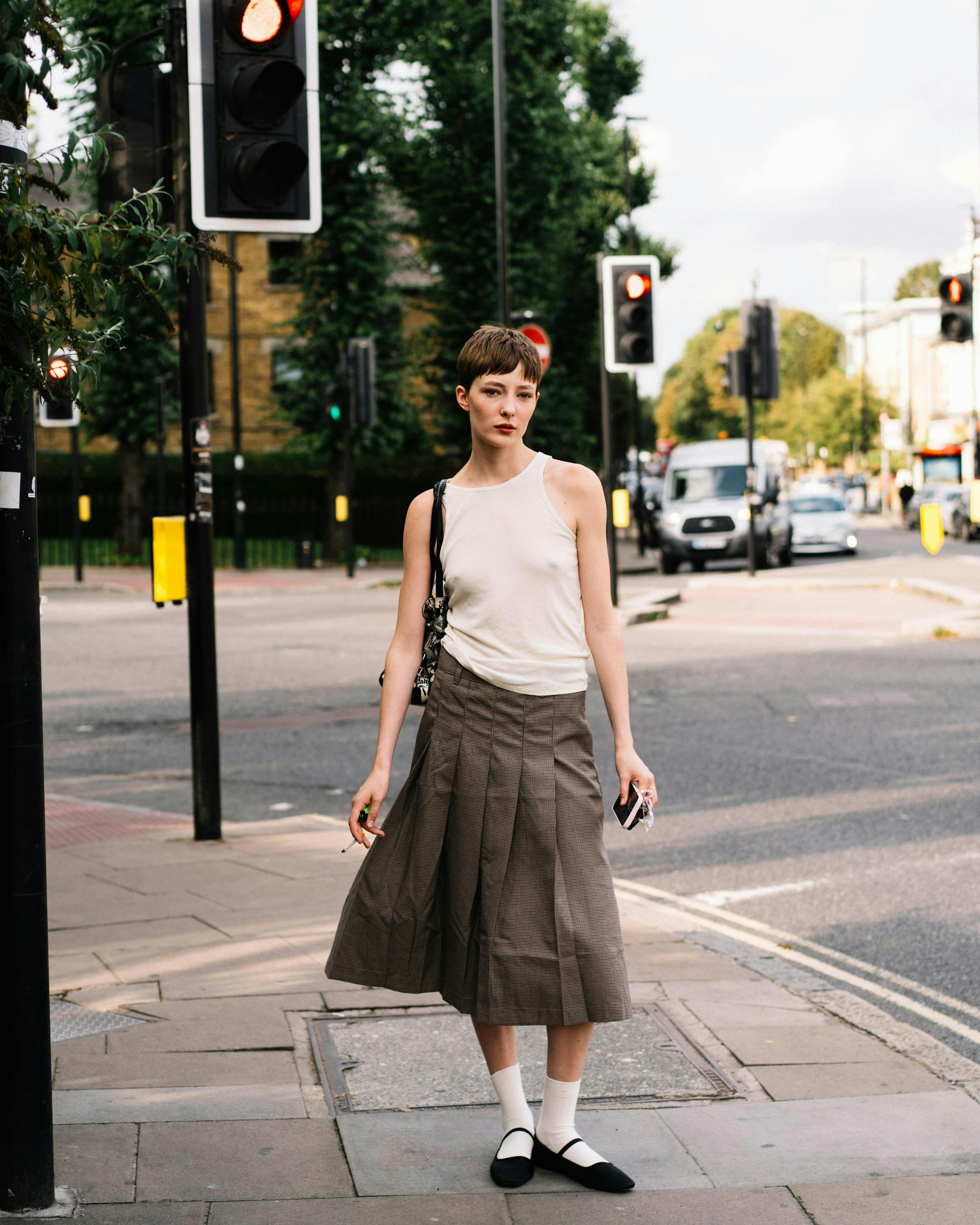 clothing skirt light traffic light person accessories bag handbag